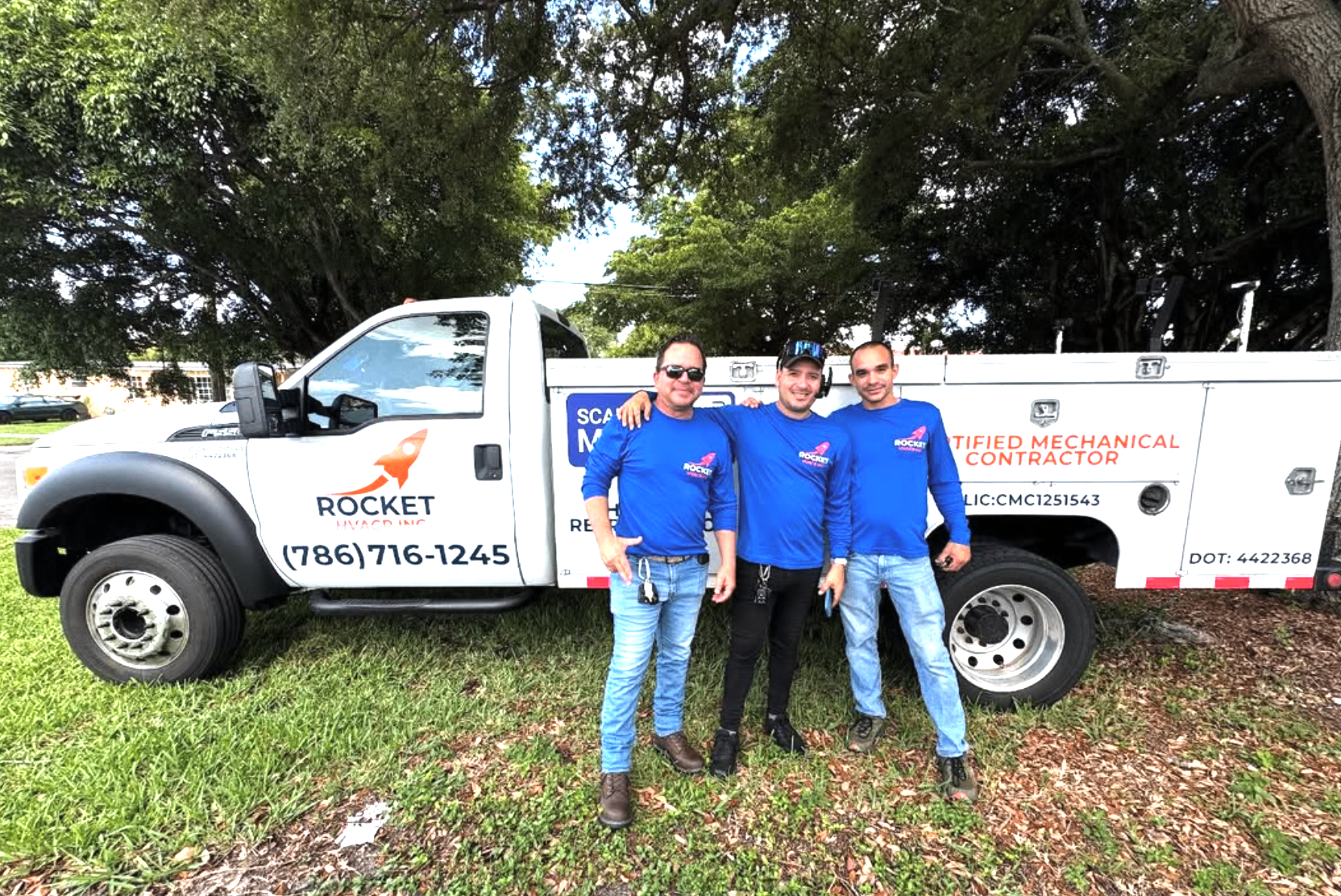 Rocket HVACR team members in front of branded truck